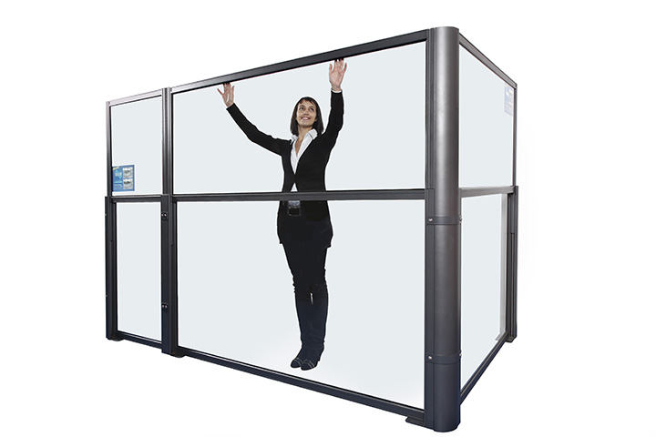 woman showing how a glass divider can be lowered with it starting in the up position